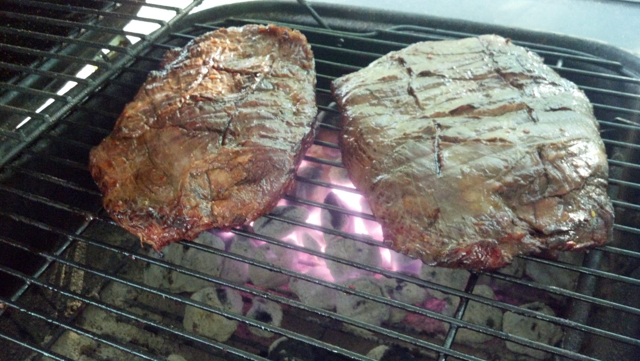 Flank steaks on the grill