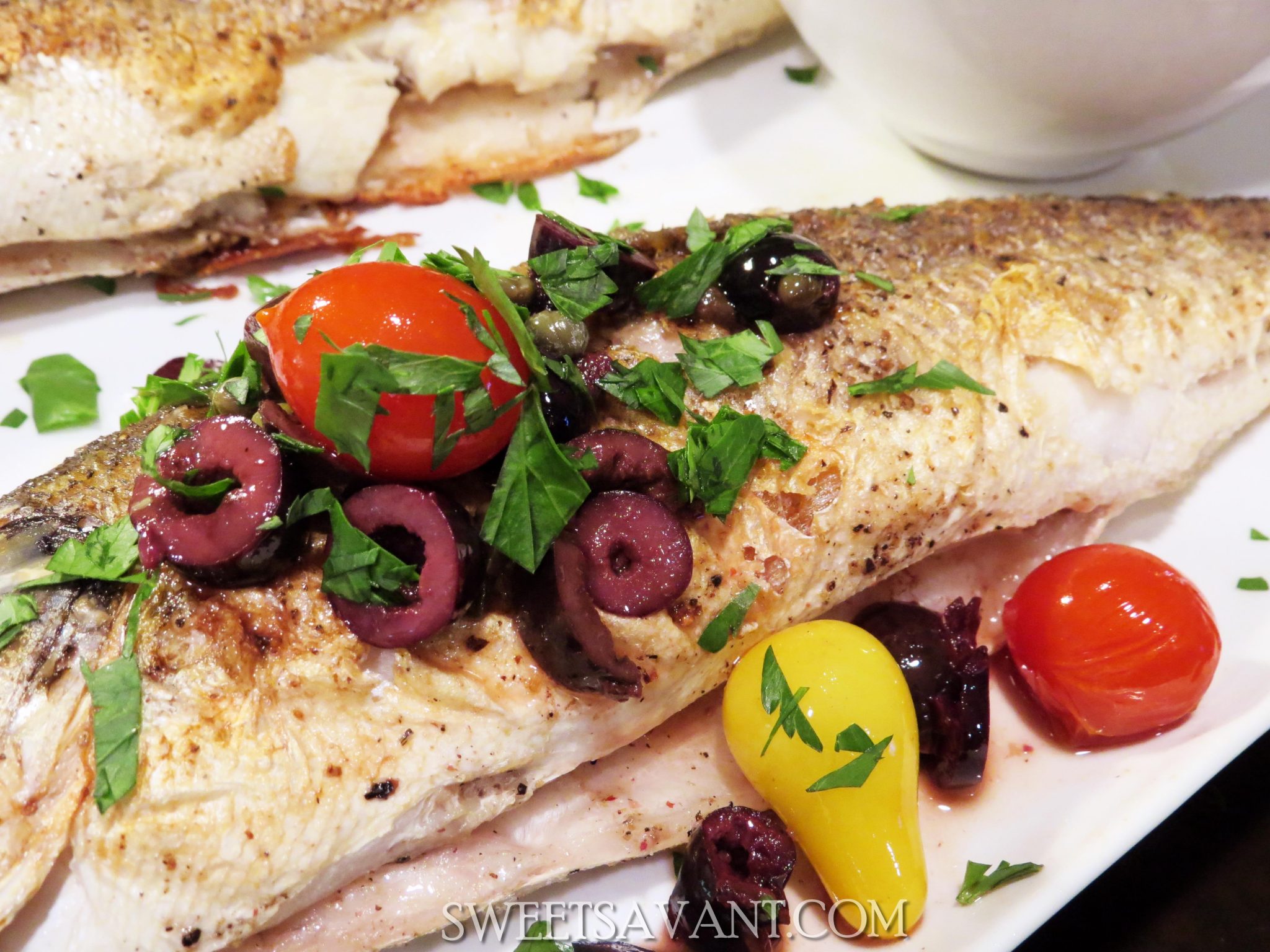 whole roasted branzino fish with olives and cherry tomatoes sweetsavant.com America's best food blog